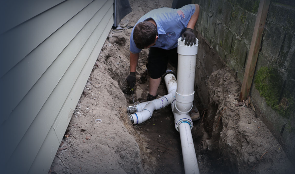 Plumber Working On Sewer Line
